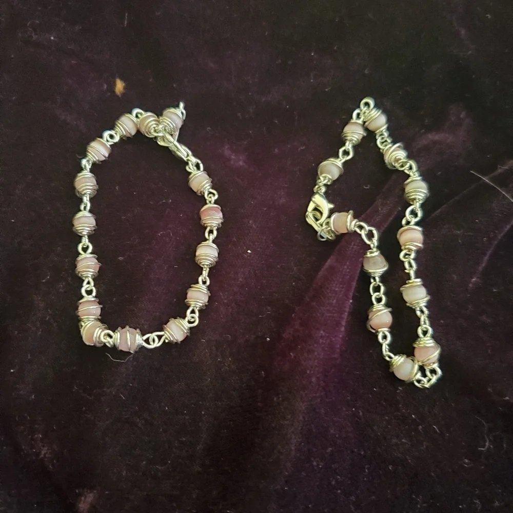 Two silver with pink pearl stones